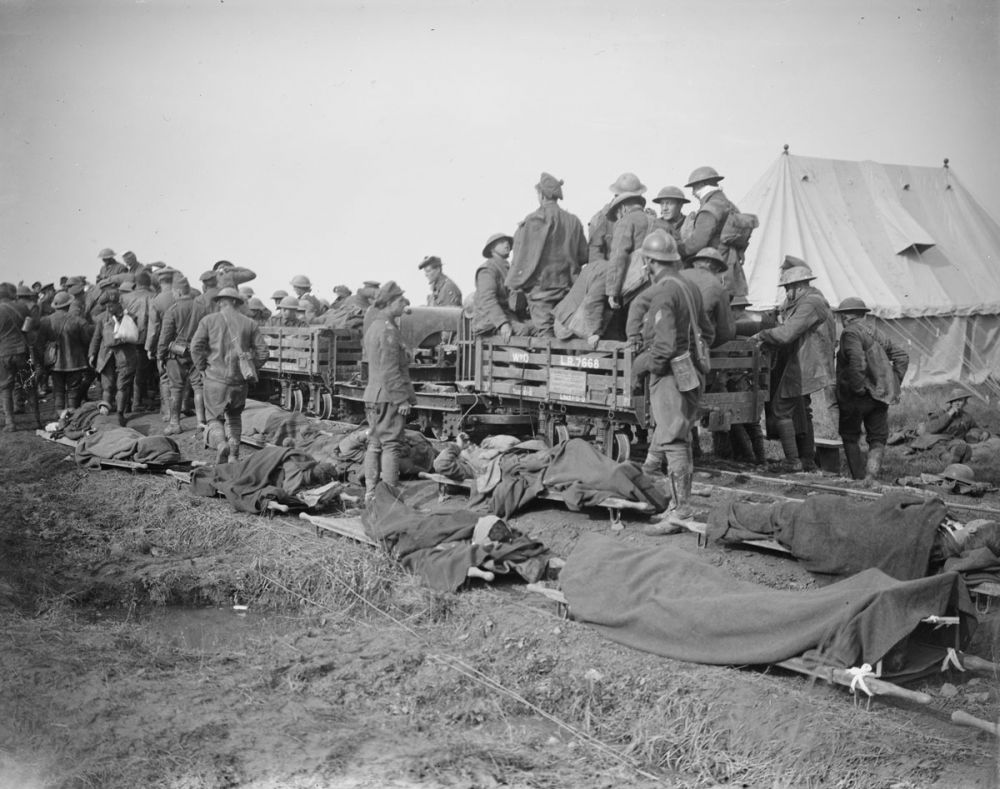 British and Belgian wounded waiting to be evacuated by light rail during the Battle of Courtrai, Dadezeele, 15 October 1918.